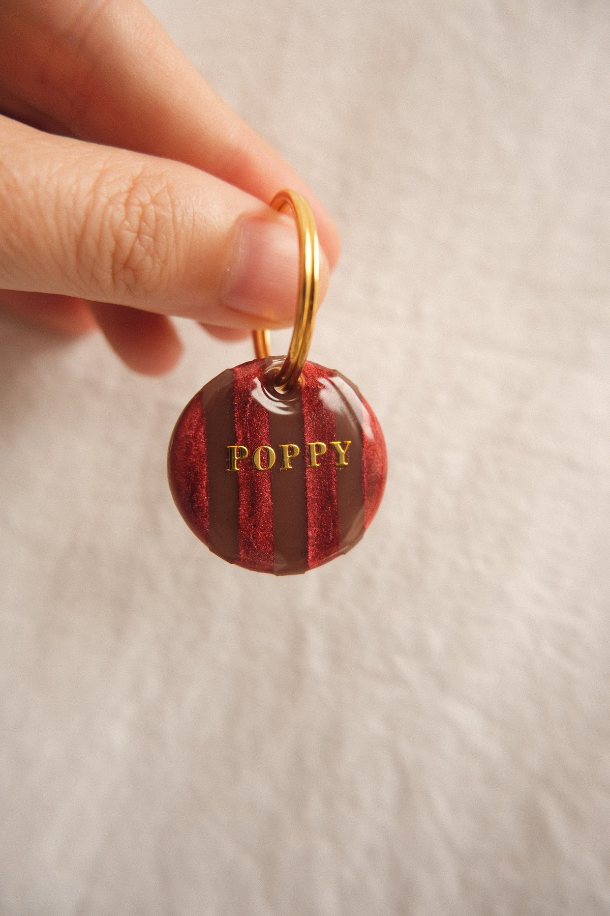 Médaille rayée chocolat & bordeaux